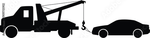 A tow truck is lifting the front end of a car off the ground.