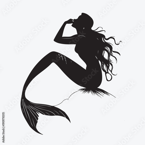 Mermaid silhouette with long hair and fish tail sitting pose