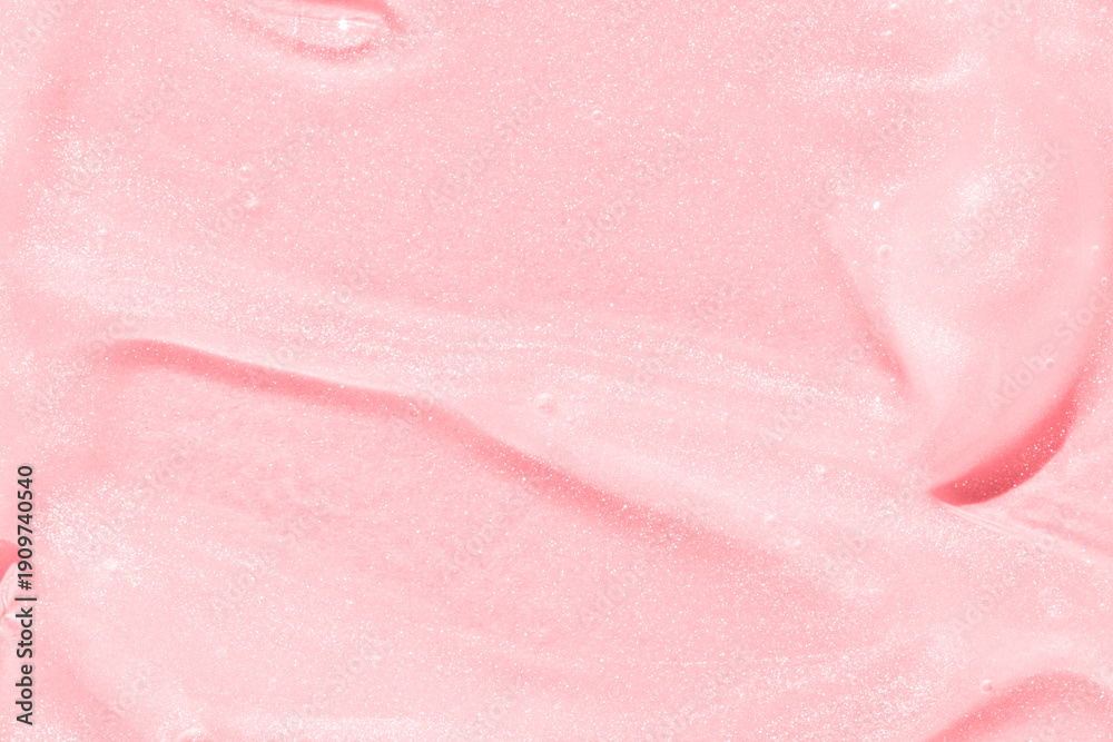 Fototapeta premium Smooth pink texture with shimmery sparkle, ideal for cosmetic or skincare background and product presentation.