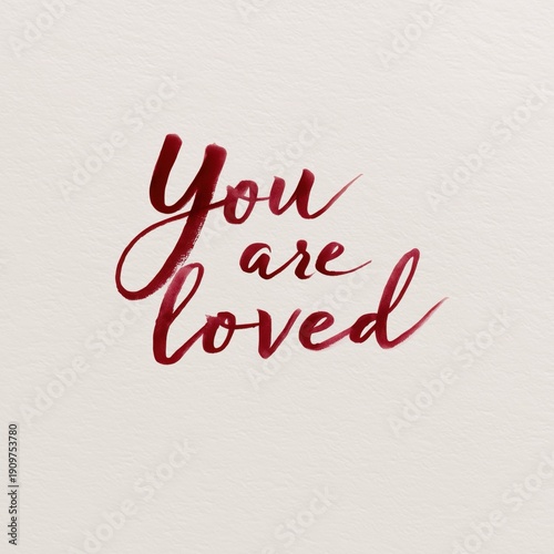 “You are loved” handwritten calligraphy for Valentine’s Day invitation card and romantic greeting design