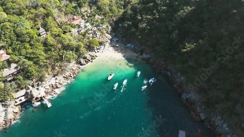 Drone flying over the small beach of colomitos in puerto vallarta mexico
