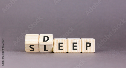 Deep sleep symbol. Concept words Deep sleep on beautiful wooden cubes. Beautiful grey table grey background. Healthy lifestyle, medical and deep sleep concept. Copy space.