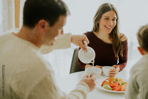 Family enjoys breakfast tog...