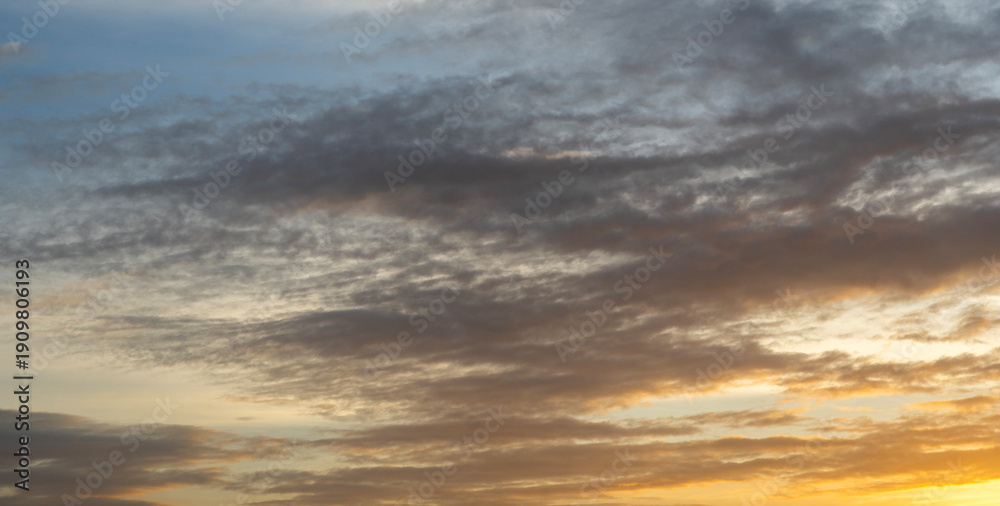 Fototapeta premium Beautiful colorful sunset with orange clouds. Sky background.