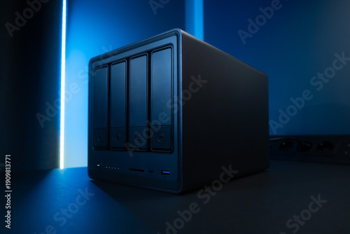 Nas Network Storage Enclosure With Five Drive Bays Under Blue Neon Lighting