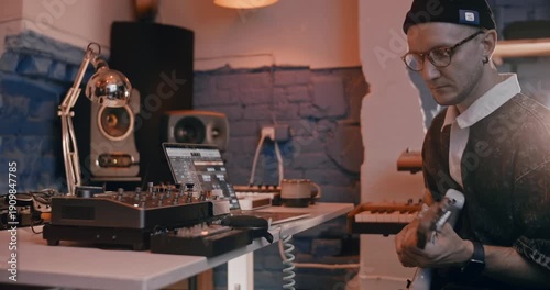 Professional musician plays instruments in the studio, sound recording process