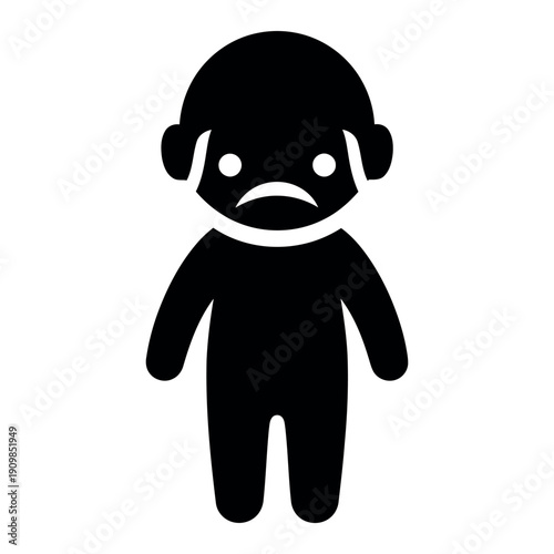 Sad child with tearful expression standing alone