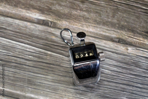 a mechanical hand tally counter, a handheld, battery-free device used for manual counting, used for tracking laps, inventory, Tasbih counting in Islam, guest counts, and traffic