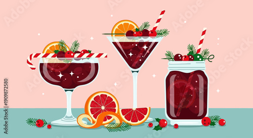 Festive cocktails garnished with fruit and candy canes on a tabletop, captured from a straightforward viewpoint.