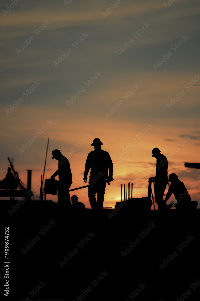 Fototapeta premium Silhouetted Workers Packing Painting Tools at Sunset in Cinematic Realism