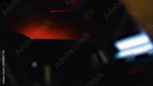 Inside Patrol Car With Flashing Red and Blue Lights at Night
