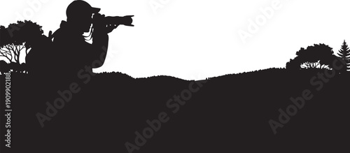 Silhouette of a photographer with a backpack in the mountains, capturing the landscape, adventure and hobby concept