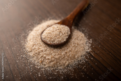 Fotografi Psyllium husks or isabgol in a spoon on the table