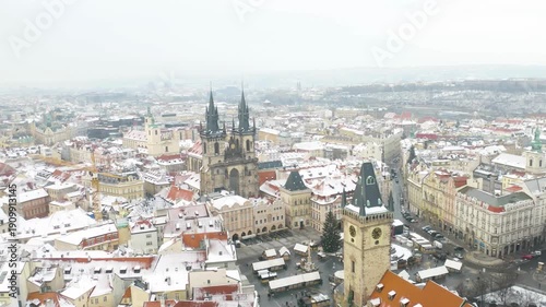 Wallpaper Mural breathtaking Aerial view of Old Town Square the historic city center of Prague, Czech Republic during winter season, snow covered houses and buildings.  Torontodigital.ca