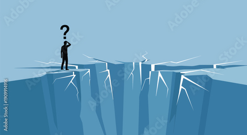 Confused businessman standing on edge of cracking cliff