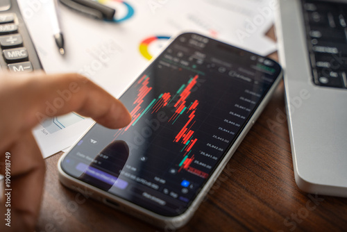 Trading chart on phone screen in Bangalore, India, on February 04, 2026