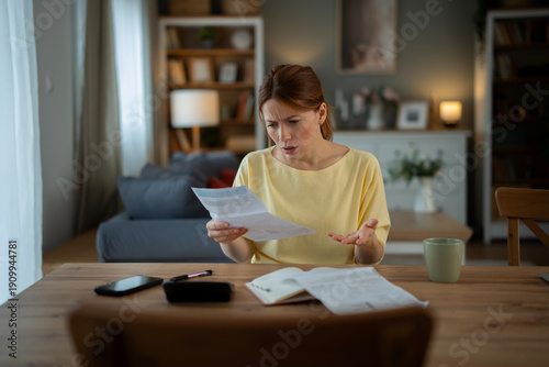 Fotografi Woman feeling stressed getting bad news about bills
