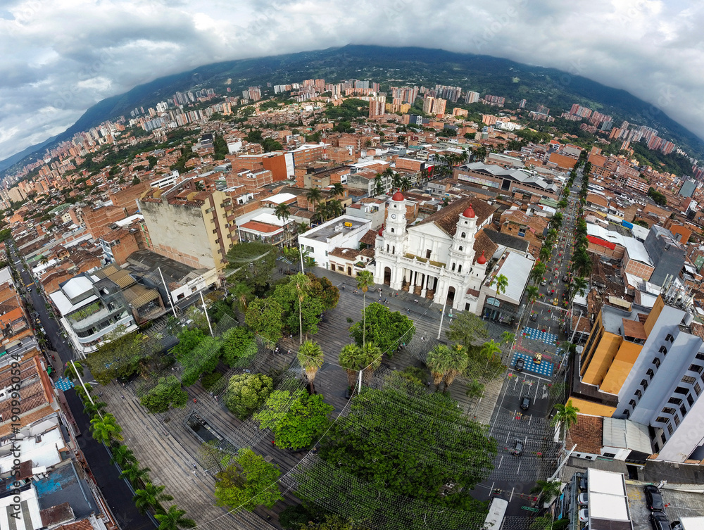 Fototapeta premium Envigado, Antioquia - Colombia. February 8, 2026. Panoramic drone view of the town's main church.
