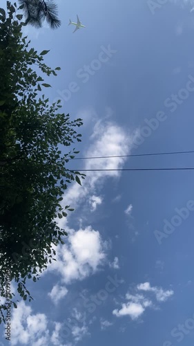 An airplane flying in the blue sky