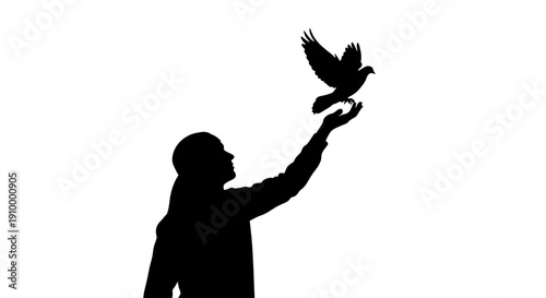 Man releasing a bird.