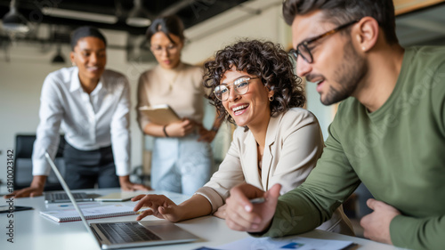 Collaborative team meeting in a modern office environment with diverse professionals