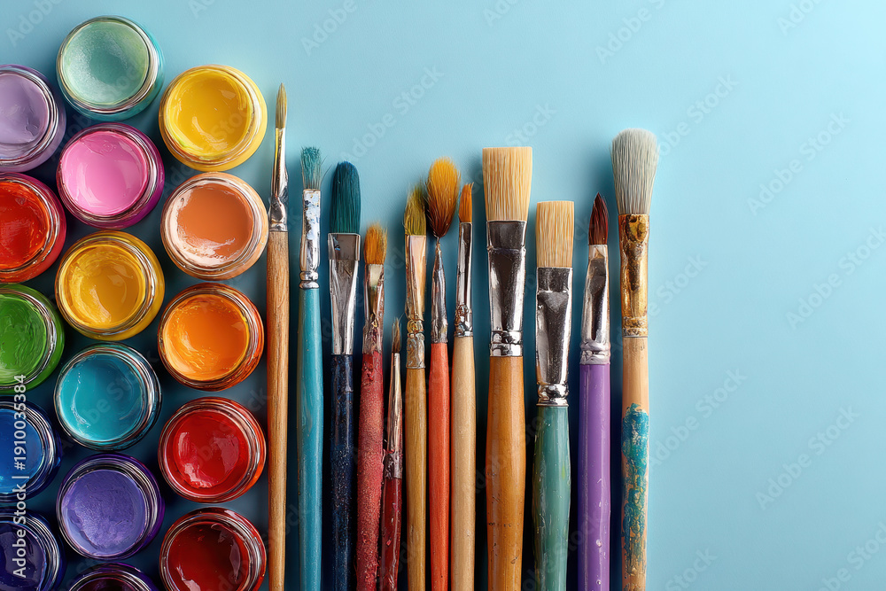 Fototapeta premium Art Supplies Displayed in a Flat Lay Arrangement With Vivid Colors on a Clean Surface During Daylight