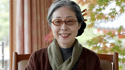 Elderly Asian woman smiling and nodding in agreement