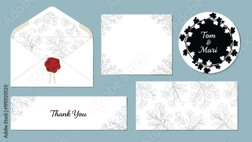 Elegant wedding stationery set including an invitation card envelope with red wax seal and floral patterns for a special wedding ceremony.