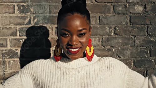 Woman in white sweater showing muscles