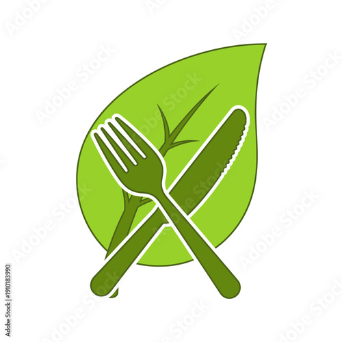 Green fork and knife on leaf representing healthy eating
