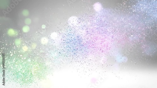 Vibrant colorful particles exploding and scattering across a light background