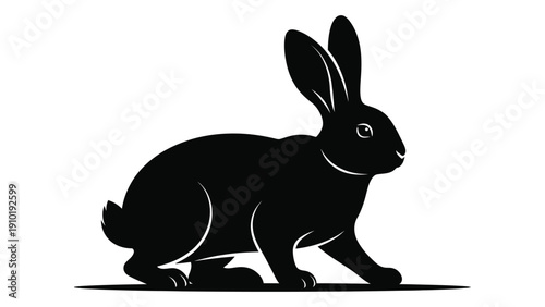 A black silhouette of a rabbit sitting with its ears perked up and alert. isolated on white background, Vector