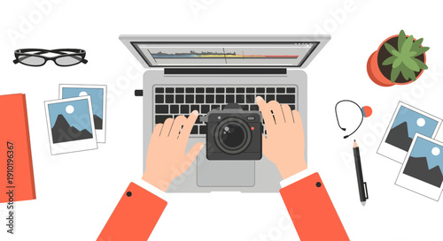 Photographer working on laptop with camera and photos around.