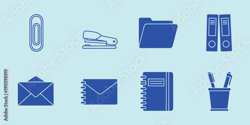Office supplies in blue on light blue background paperclip stapler