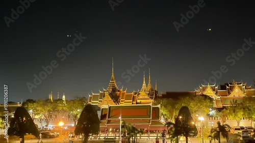Wat Phra Kaew in Bangkok Thailand is an ancient royal palace and golden Buddhist temple featuring Thai architecture and religious pagoda landmarks