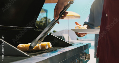 Photos Bbq, corn and grill with hands of person outdoor of house for cooking, cookout event and barbecue