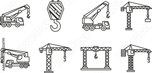 Various cranes and construction equipment in modern industrial setting