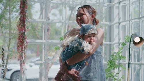 4K Beautiful lifestyle of an Asian mother holding her baby travel outdoor.