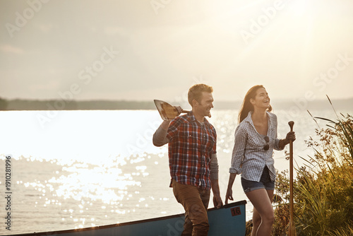 Obraz na plátně Happy couple, sunshine and lake for canoe ride with travel, bonding and paddle for rowing