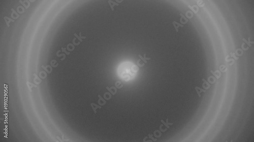 Concentric Gray Rings Expanding from Center Point