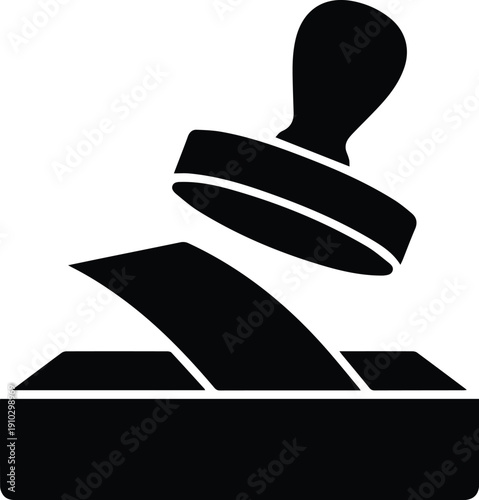 Black stamp pressing down on paper on white background rubber stamp seal