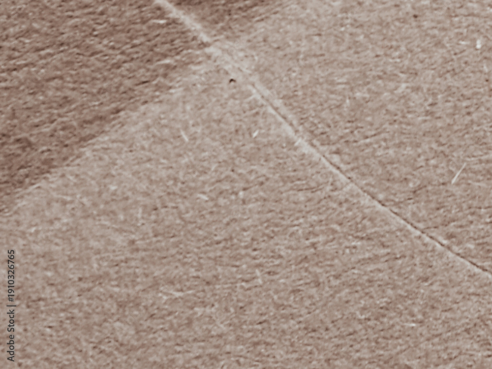 Fototapeta premium Close-up shot of a textured, light brown surface background