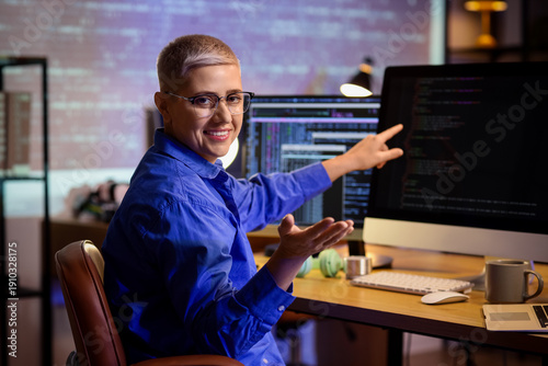 Female programmer working i...