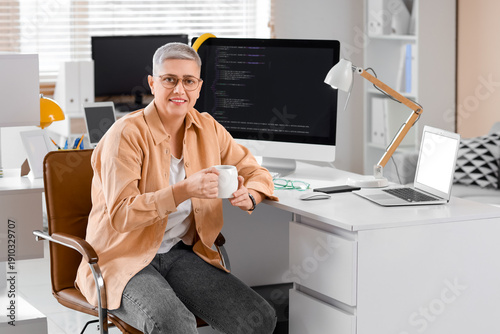 Female programmer with cup ...