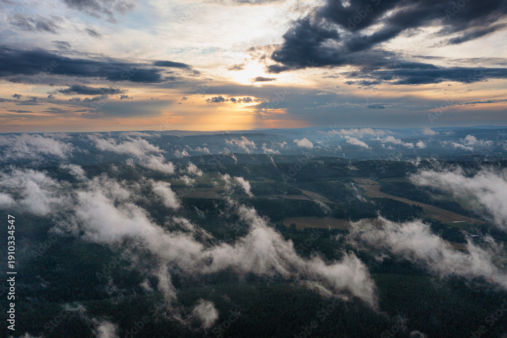 Obraz premium Southern Urals in summer: morning fog over the mountains. Aerial view.