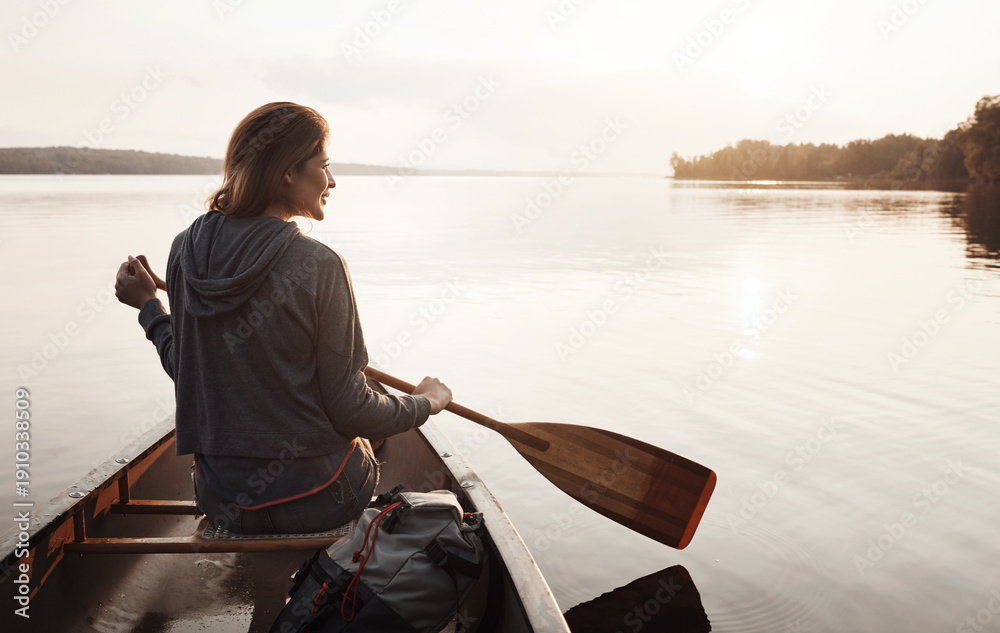 Fototapeta premium Thinking, woman and smile with canoeing on lake for travel adventure, sightseeing nature or space. Sunshine, back of person or rowing boat on water for peaceful tourism, journey reflection or freedom