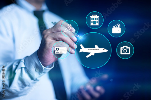 Businessman touching virtual airplane icon surrounded by travel-related symbols, Flight ticket booking concept. Global travel and aviation technology concept