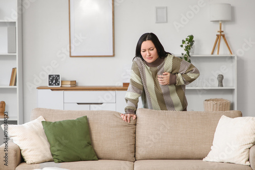 Young woman having heart at...