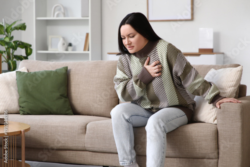 Young woman having heart at...