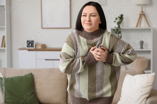 Young woman having heart at...